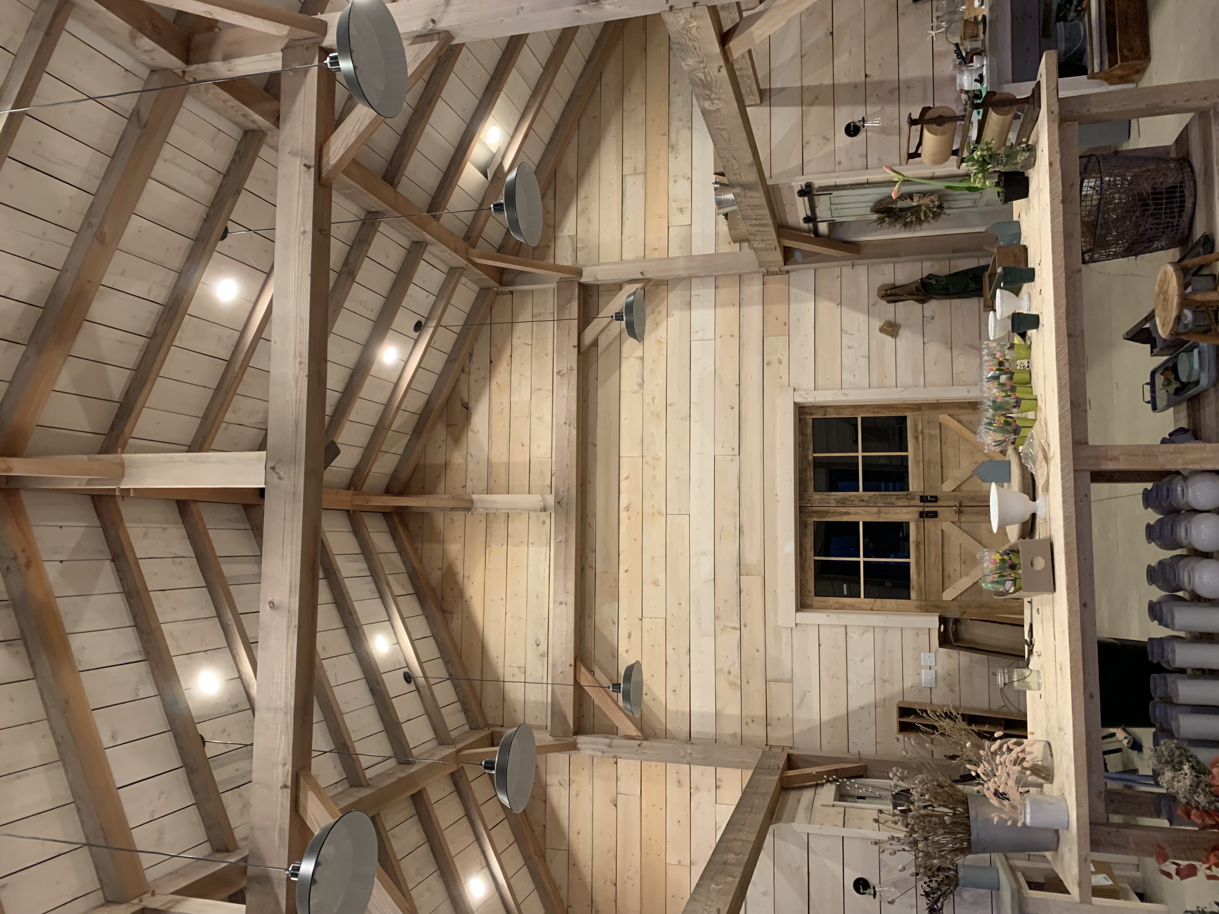 Finished interior lighting and layout in a timber-frame barn