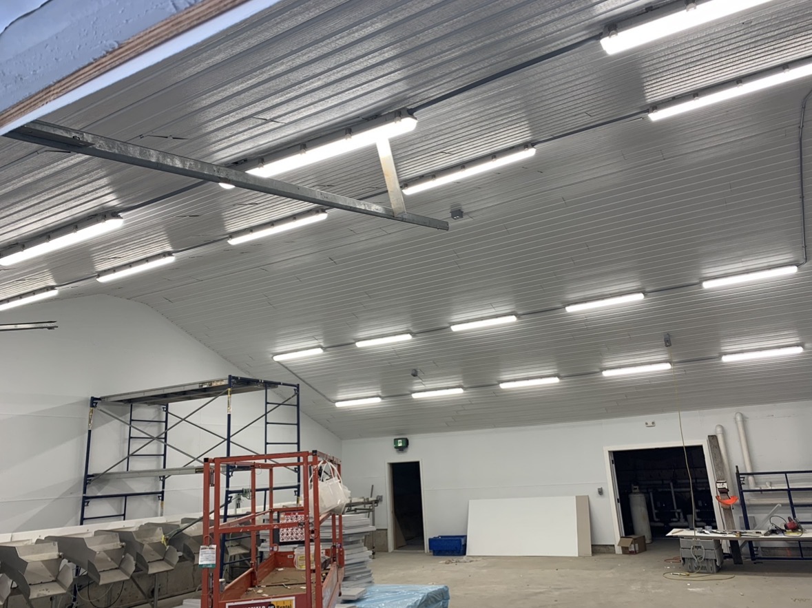 Completed commercial lighting installation in a seafood processing facility