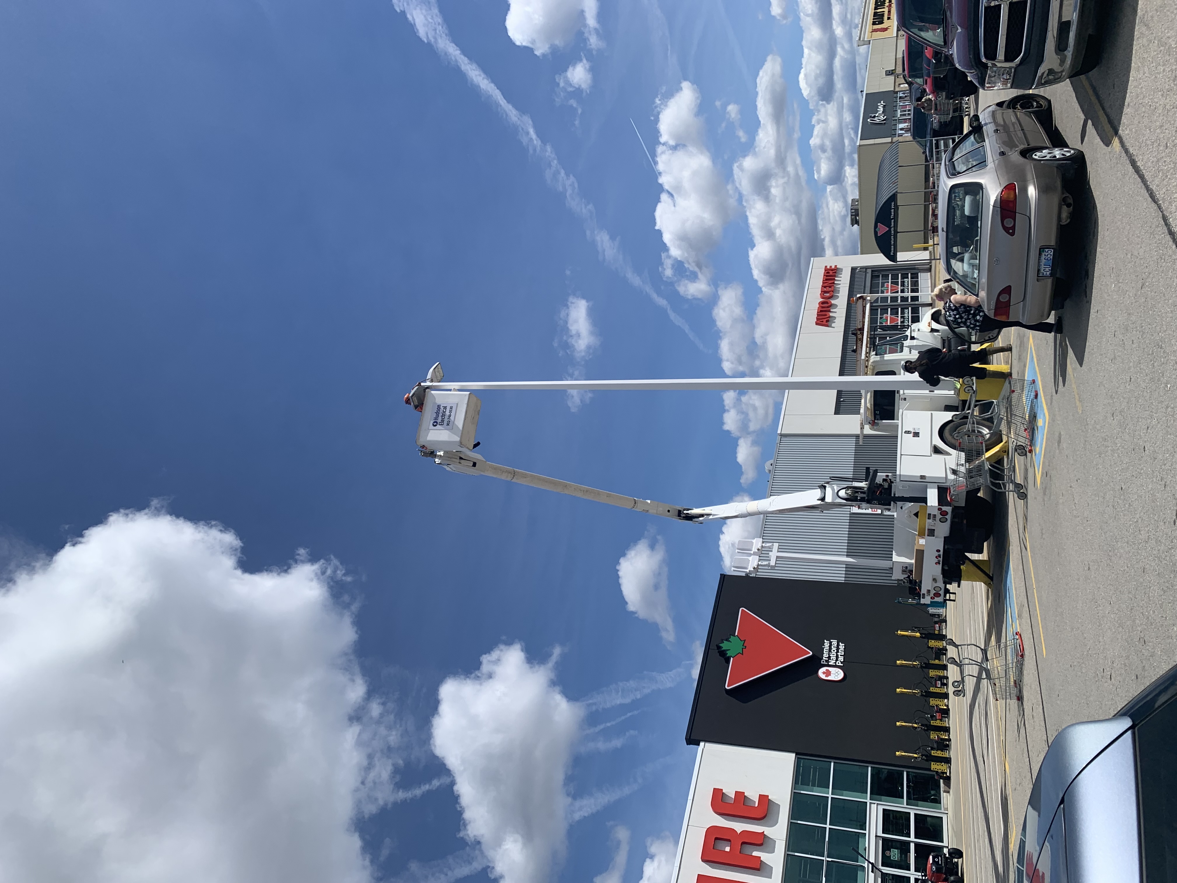 Commercial parking lot lighting repair from bucket truck