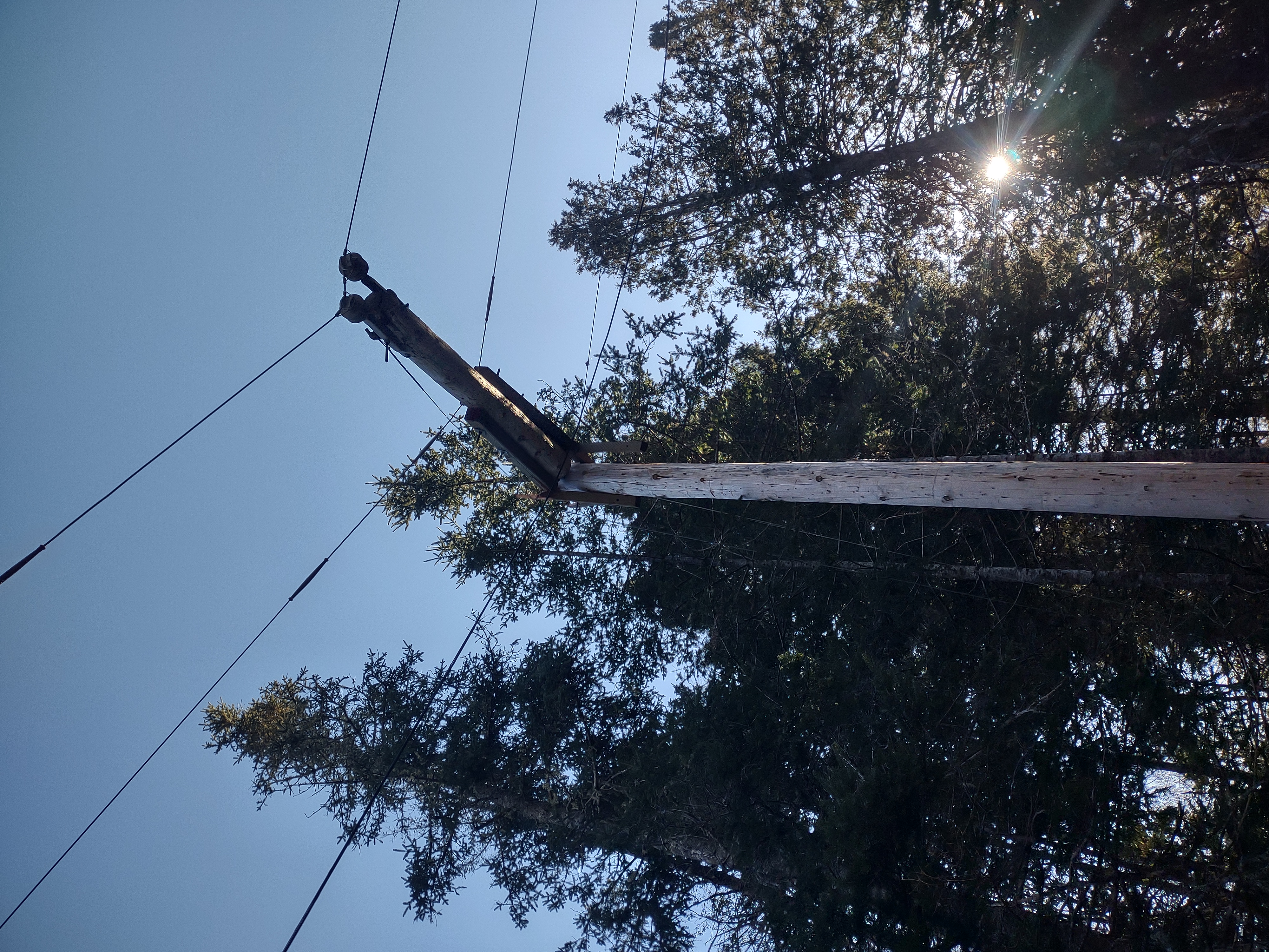 Storm-damaged broken power pole